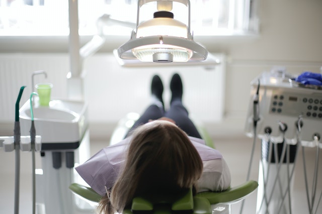 girl laying down in cosmetic dental clinic in queens ny